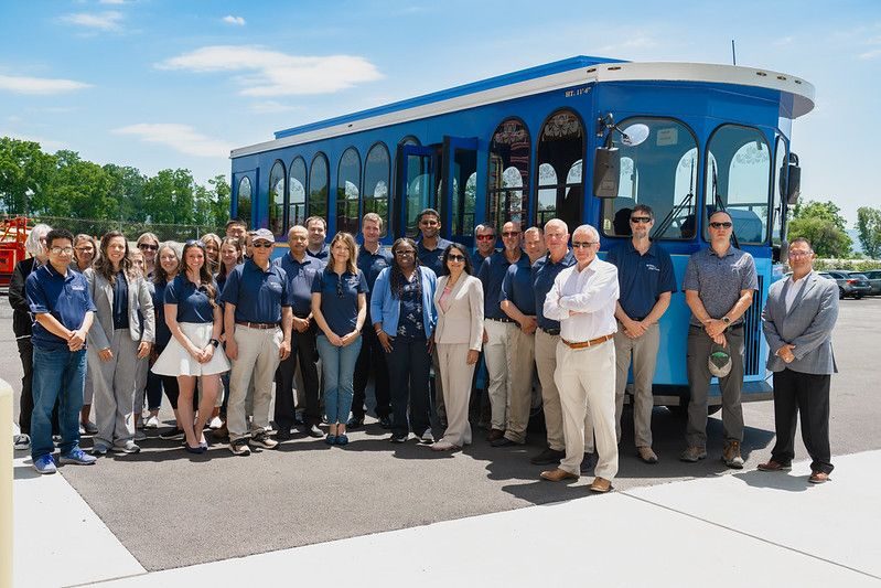 Lab members and LTI staff in front of the Penn State trolley