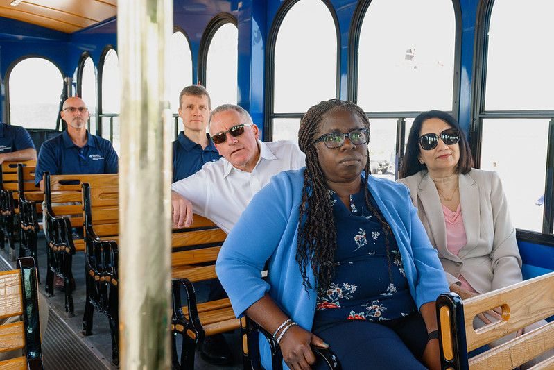 Visitors seated on the Penn State trolley during the test track visit