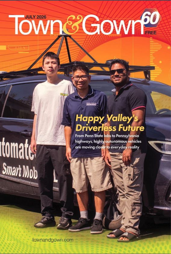 Cover of the July 2026 Town&Gown issue, Happy Valley’s Driverless Future, with lab members beside the automated vehicle