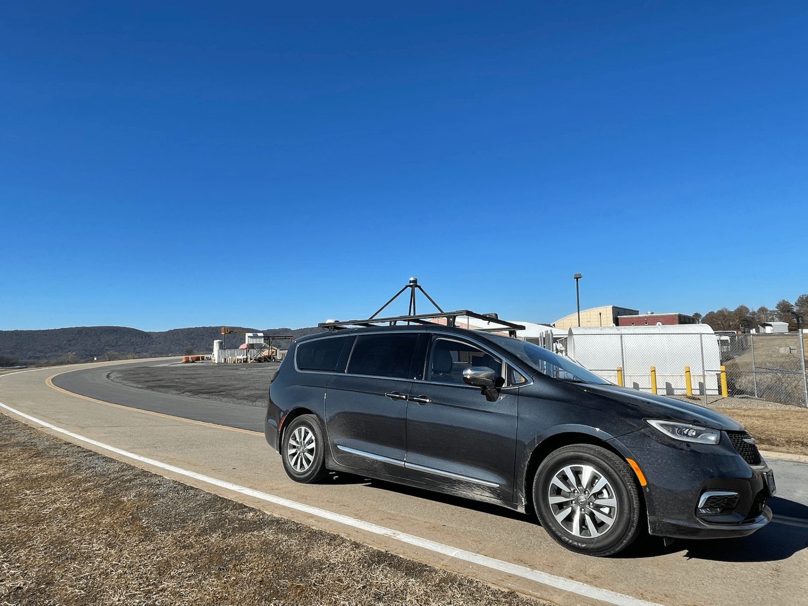 The lab’s automated vehicle on a curve of the test track