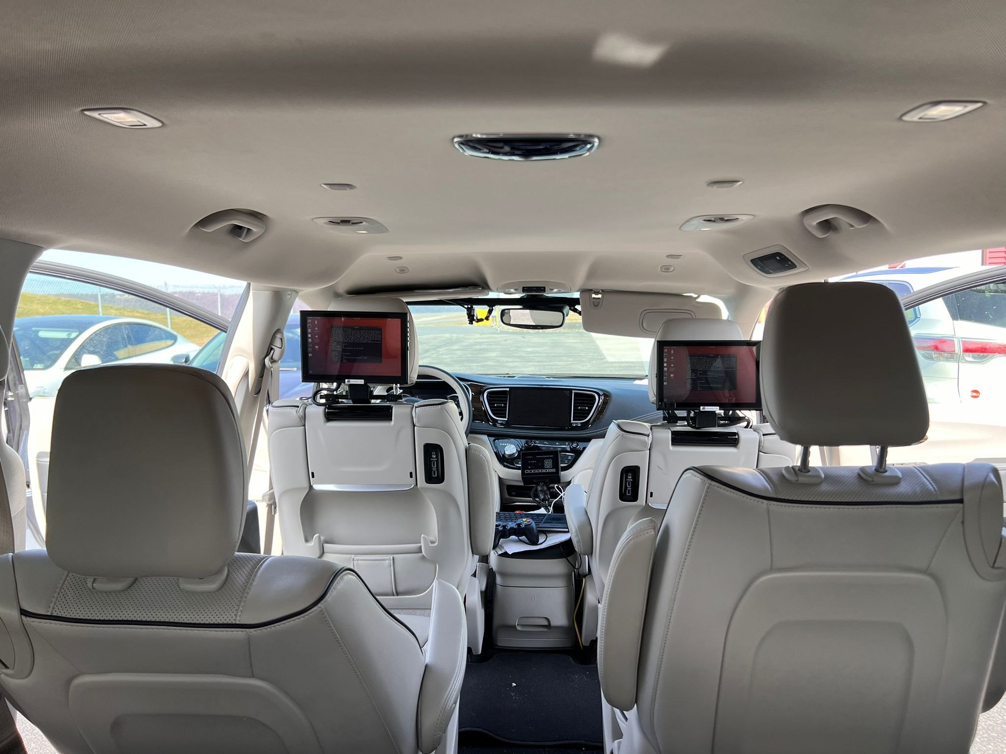 Rear-seat displays showing the automation software