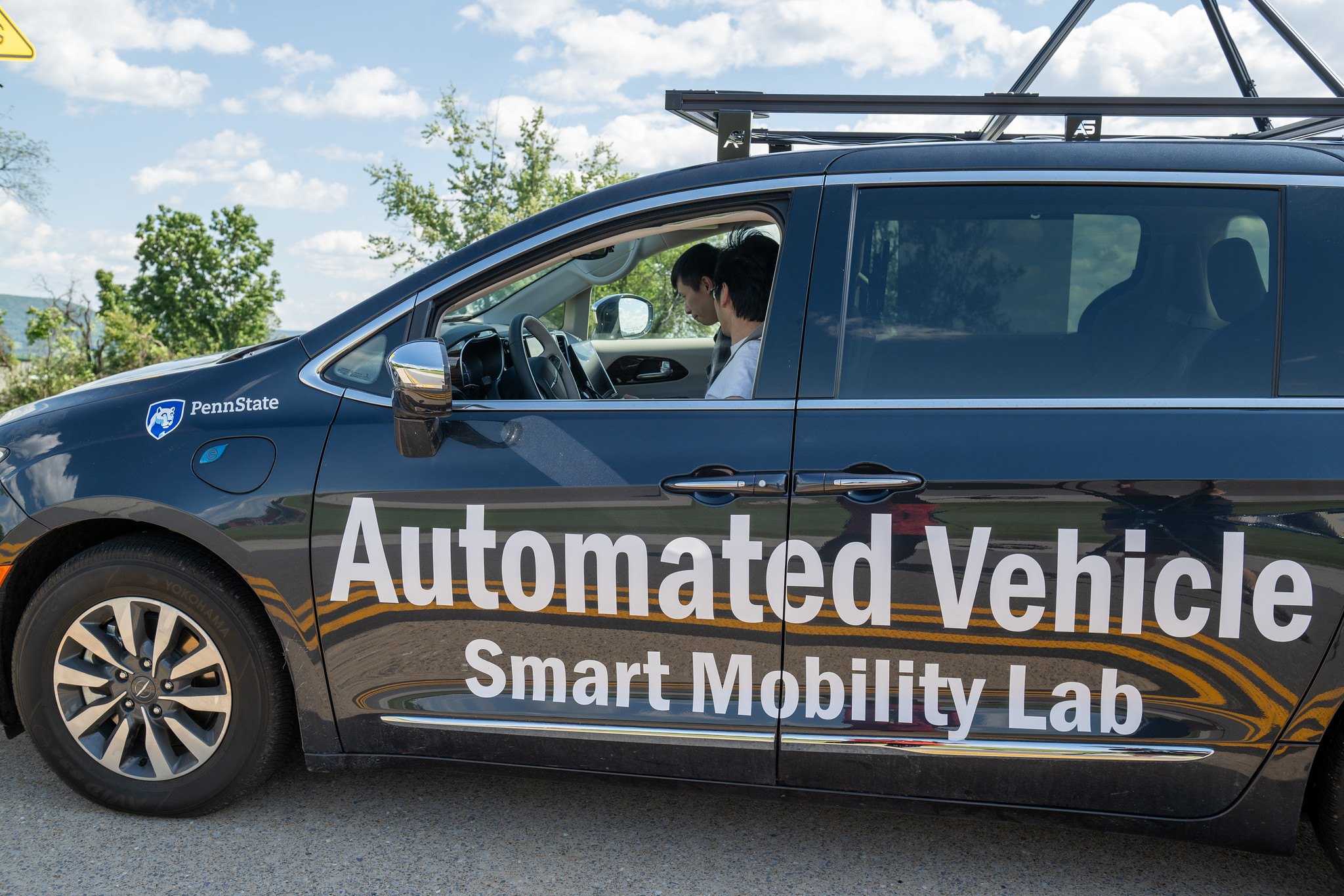 Close-up of the vehicle wrap reading Automated Vehicle, Smart Mobility Lab